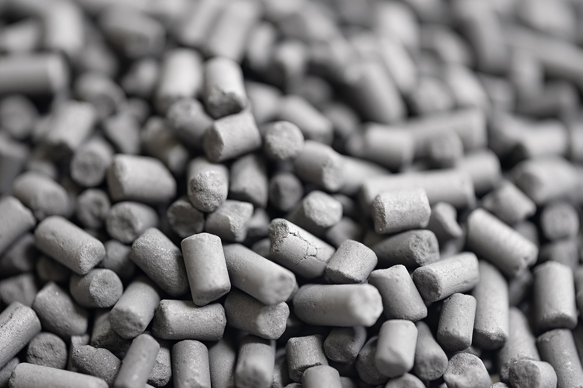 Close-up of granular activated carbon pellets used as adsorption media in PFAS water treatment systems