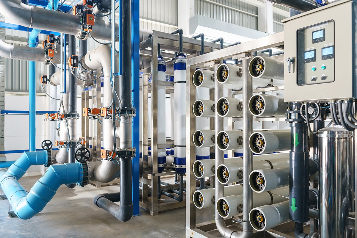 Reverse osmosis membrane housings and treatment piping inside a water treatment facility — state PFAS drinking water regulations are diverging from federal standards